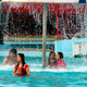 Indian women play in a water park.